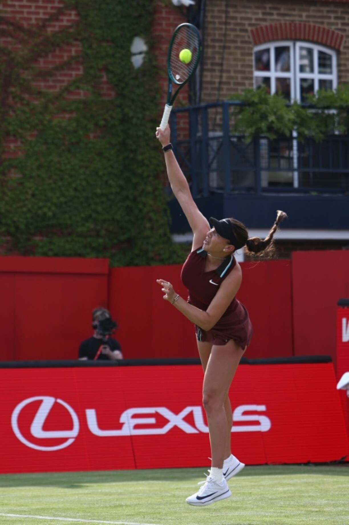 Amanda Anisimova in full flight against Jodie Burrage on the opening day of the WTA event at Queen's Club in west London