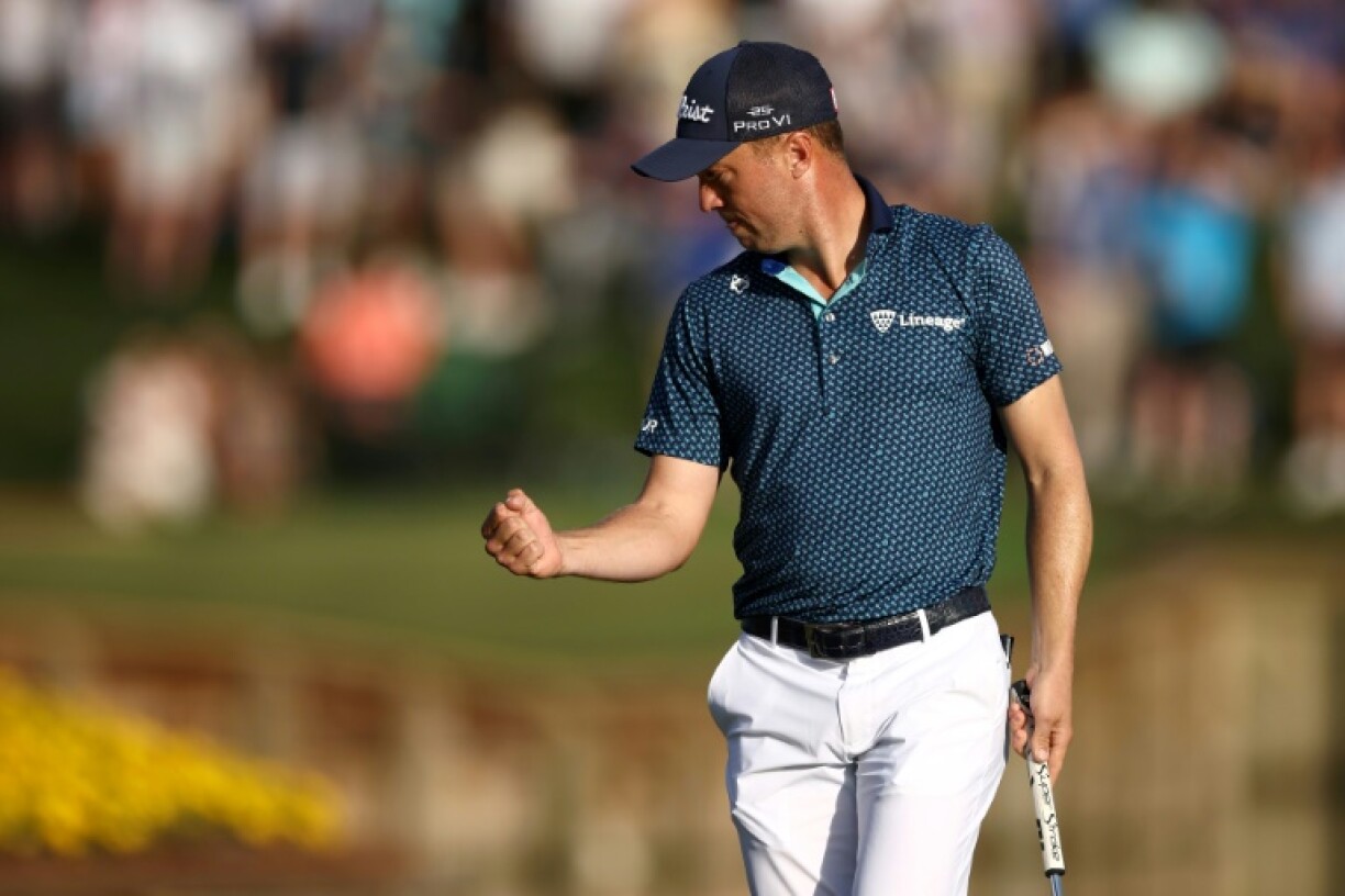 American Justin Thomas, pumping his fist after a birdie at 17, matched the course record with a 62 in Friday's second round of the PGA Players Championship at TPC Sawgrass