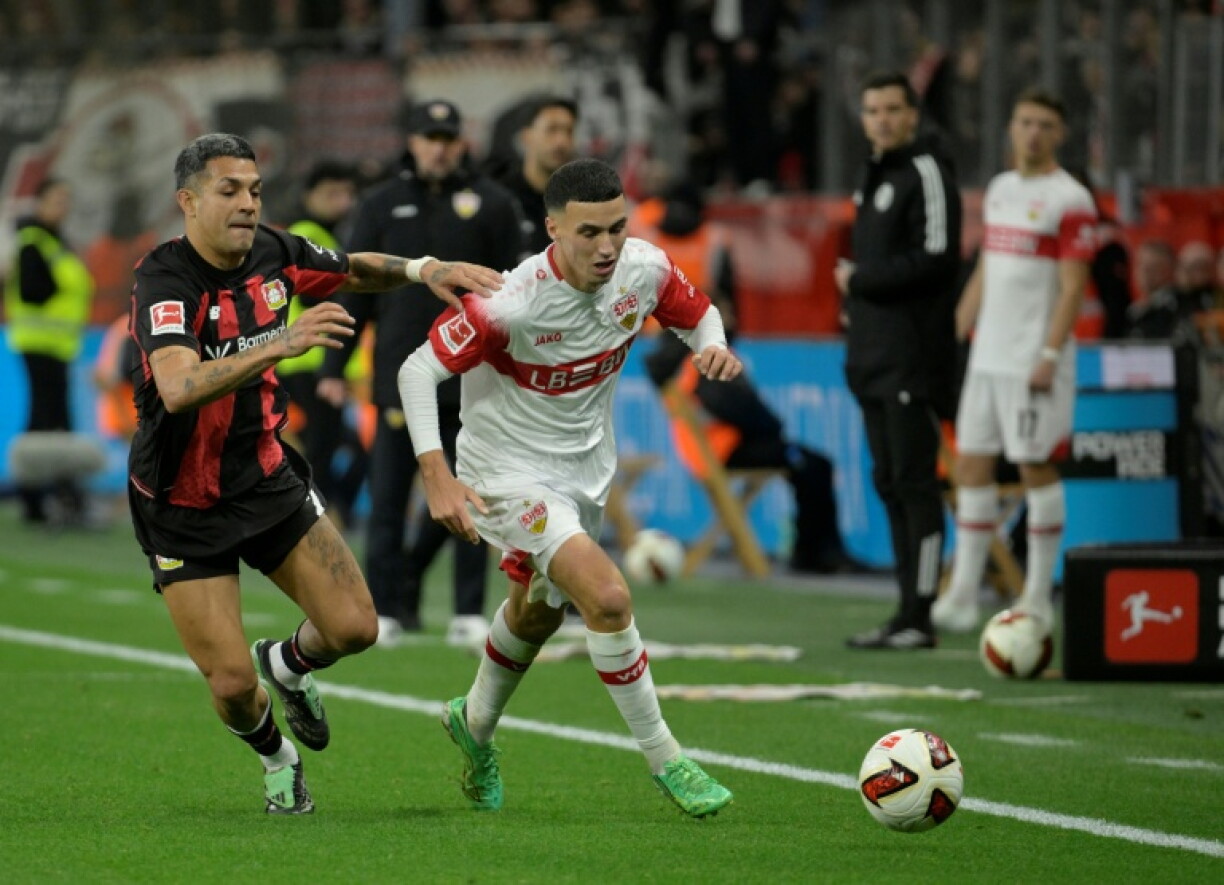 Bilal El Khannouss (R), a Stuttgart scorer, takes on Bayer Leverkusen defender Facundo Medina
