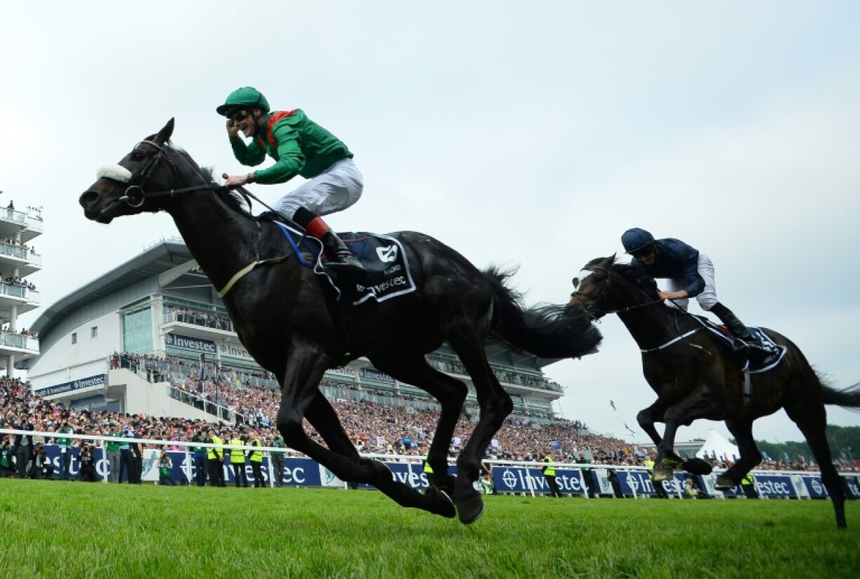 Harzand (L) ridden by Pat Smullen gave the Aga Khan his fifth Epsom Derby victory in 2016