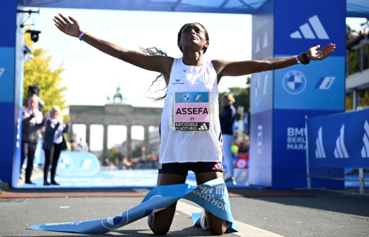 Ethiopia's Tigist Assefa celebrates after smashing the women's marathon world record in Berlin in 2023