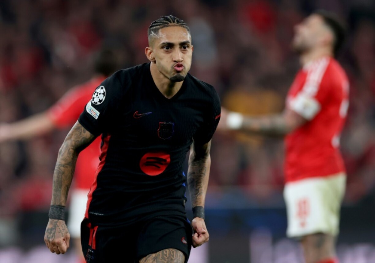 Barcelona's Brazilian forward Raphinha celebrates scoring against Benfica on Wednesday in the Champions League