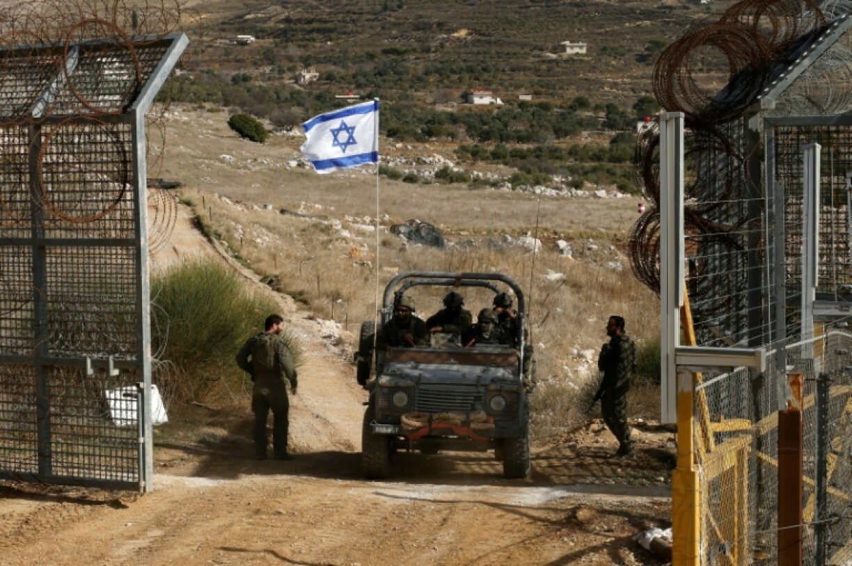 An Israeli jeep returns from a foray into the UN-patrolled buffer zone along the 1974 armistice line with Syrian forces on the Golan Heights.