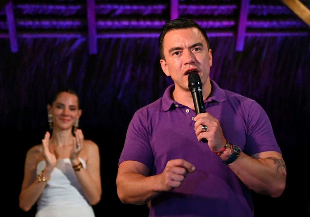 Ecuador's President and Presidential candidate Daniel Noboa talks to supporters next to his wife Lavinia Valbonesi in Olon, Santa Elena province, Ecuador on April 13, 2025.