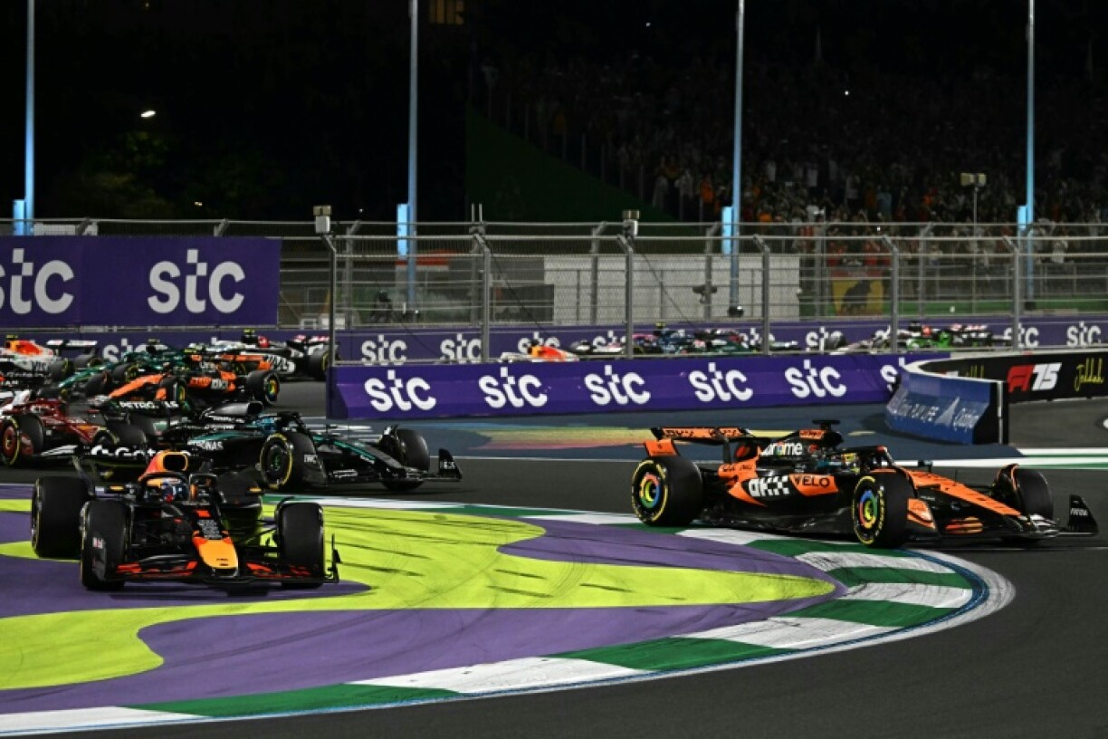 Max Verstappen (left) and Oscar Piastri's first corner tussle