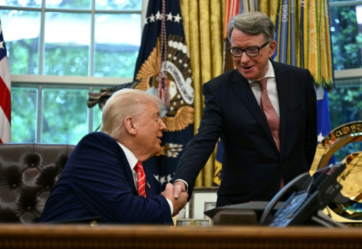 US President Donald Trump shakes hands with British ambassador to the United States Peter Mandelson after making a trade announcement in the Oval Office of the White House in Washington, DC, on May 8, 2025. US President Donald Trump on Thursday announced a