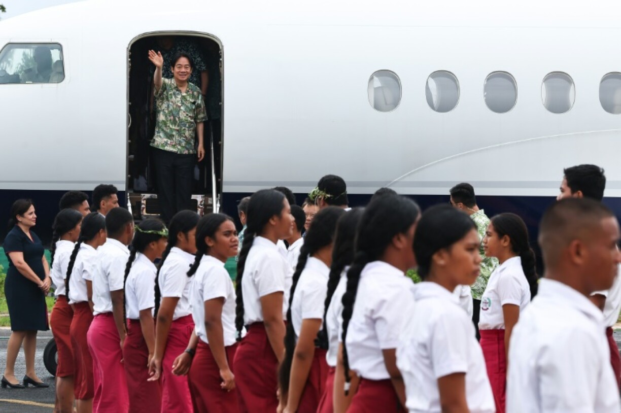 Lai smiled and waved as he stepped off the plane in low-lying Tuvalu