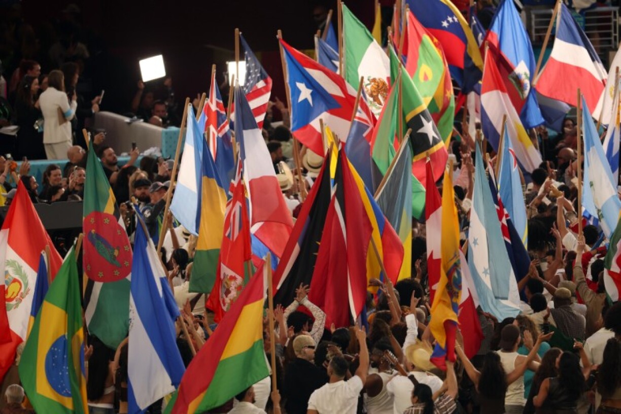 Performers wave the flags of sovereign countries in the Americas at the conclusion of Puerto Rican singer Bad Bunny performance during the Super Bowl LX Apple Music Halftime Show at Levi's Stadium in Santa Clara, California on February 8, 2026.