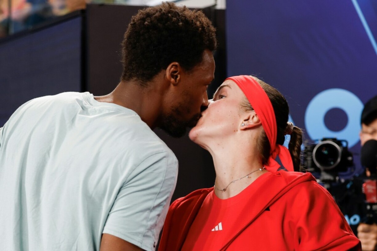 Gael Monfils kisses his wife Elina Svitolina following her victory against Jasmine Paolini
