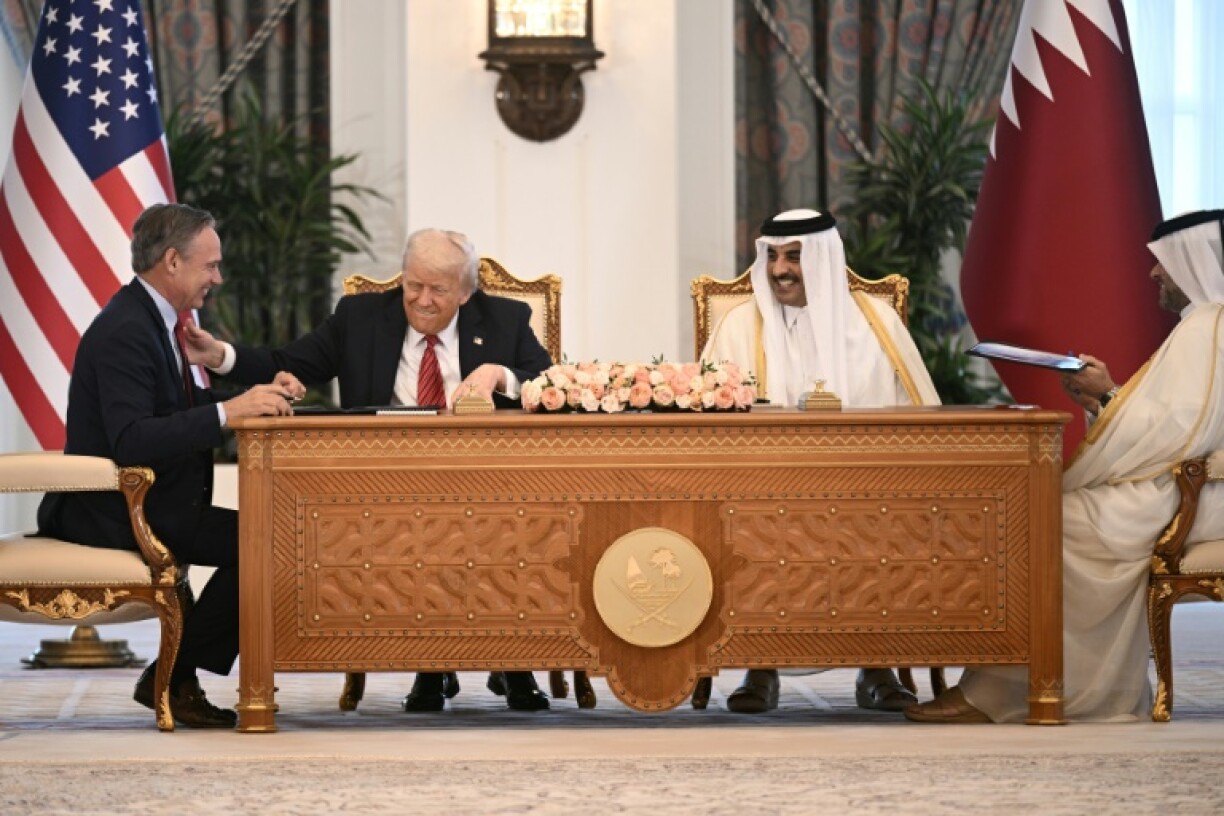 Boeing CEO Kelly Ortberg, US President Donald Trump and Qatar's Emir Sheikh Tamim bin Hamad al-Thani
