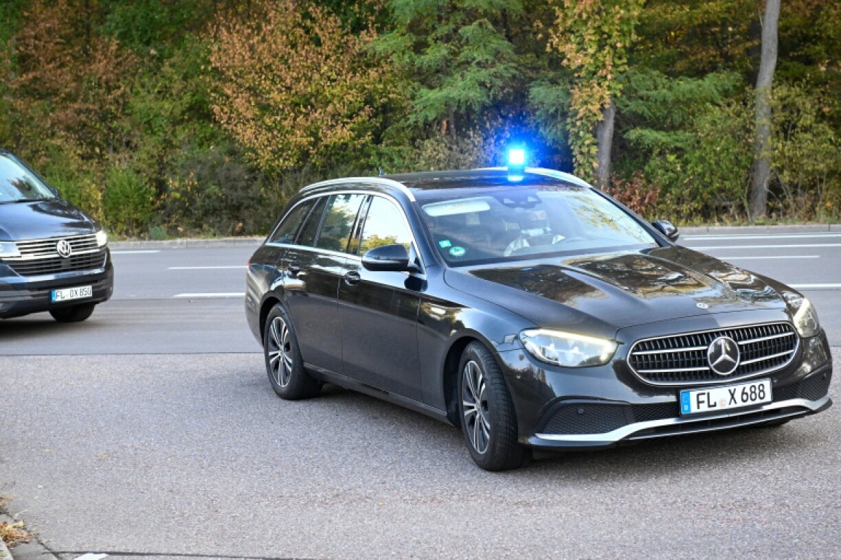A police convoy arrives at the German Federal Supreme Court ahead of an appearance by former spy chief August Hanning
