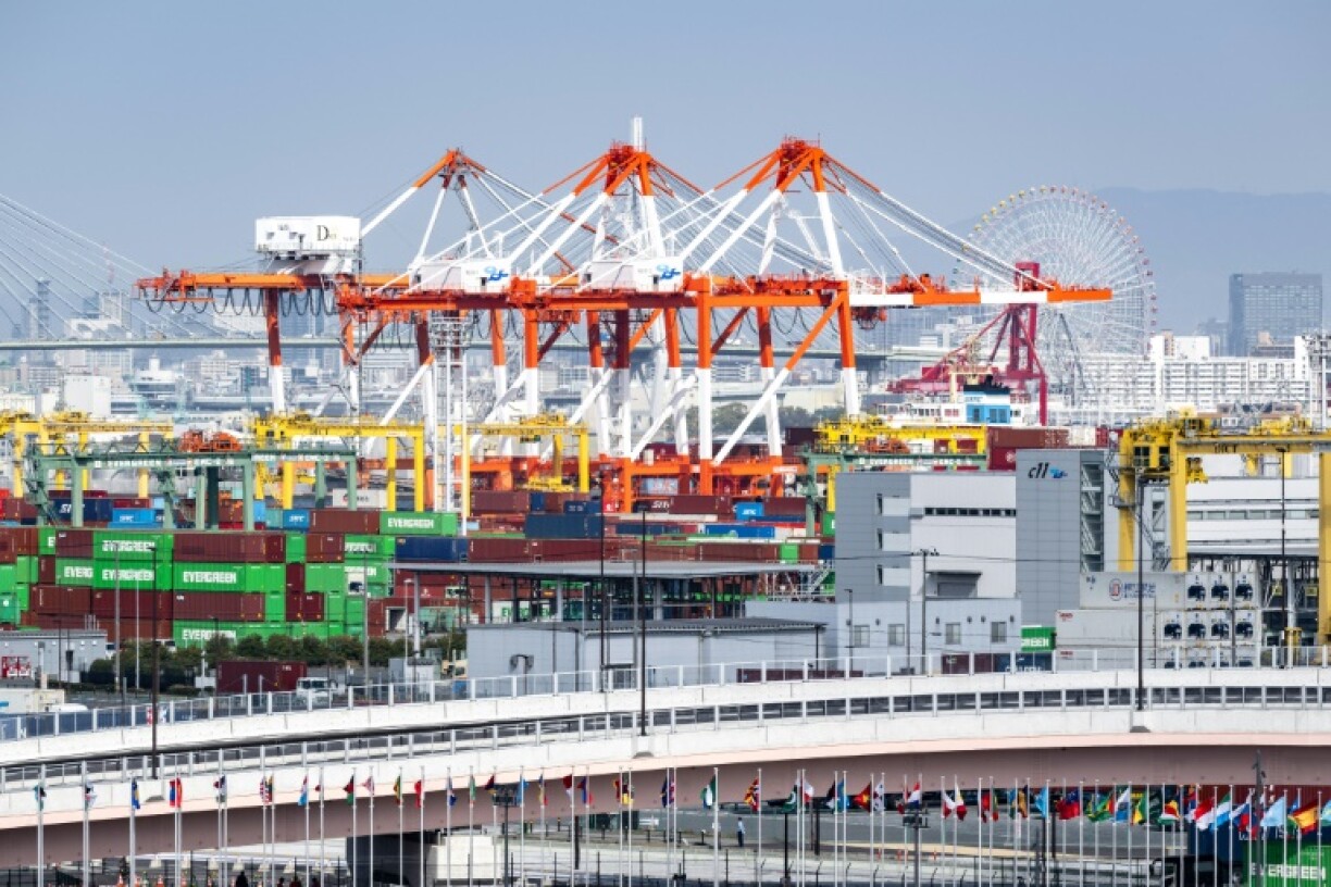 Containers being loaded in Japan are now part of a global tariff war launched by US President Donald Trump