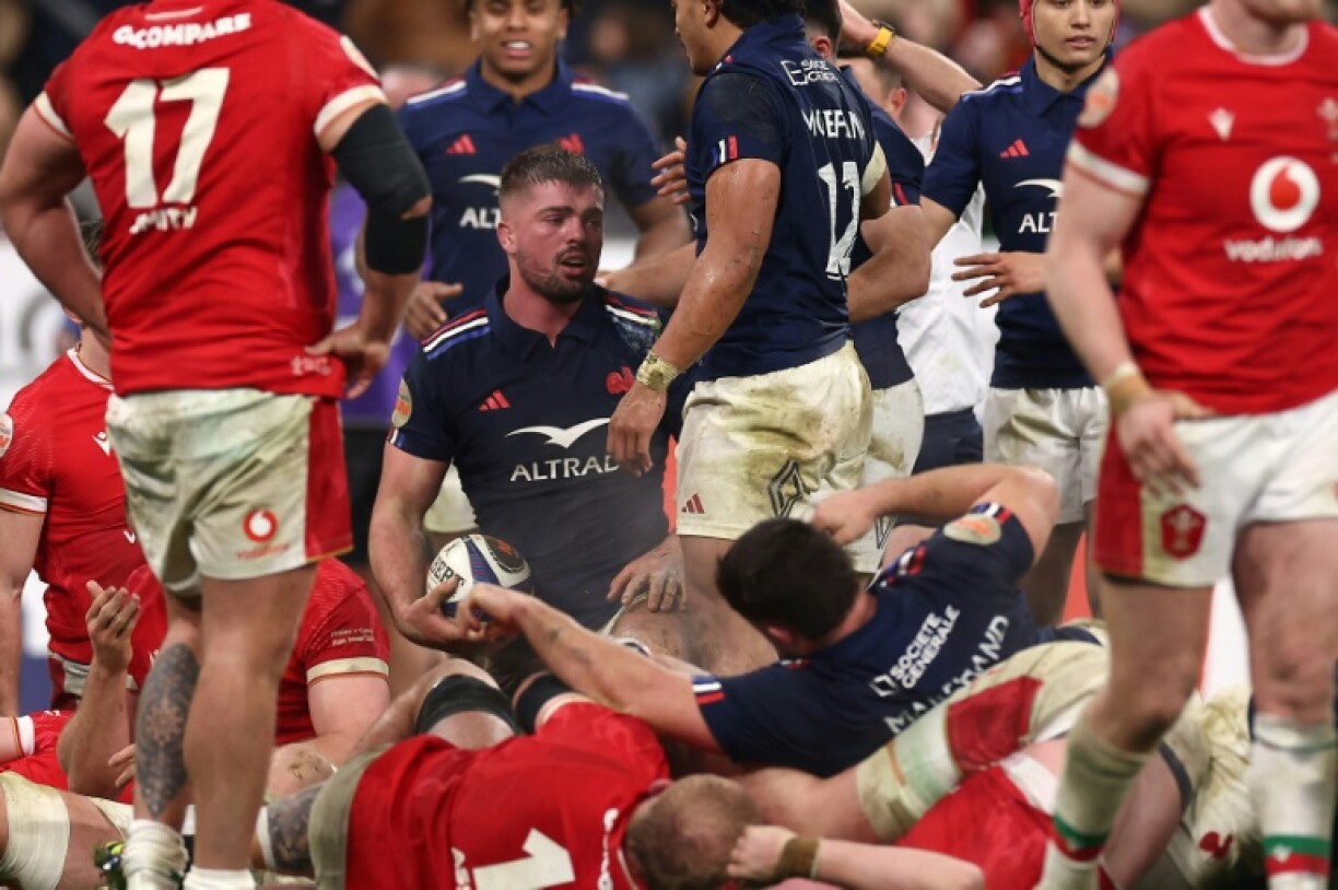 France's number eight Gregory Alldritt (CL) reacts after scoring France's seventh try against Wales
