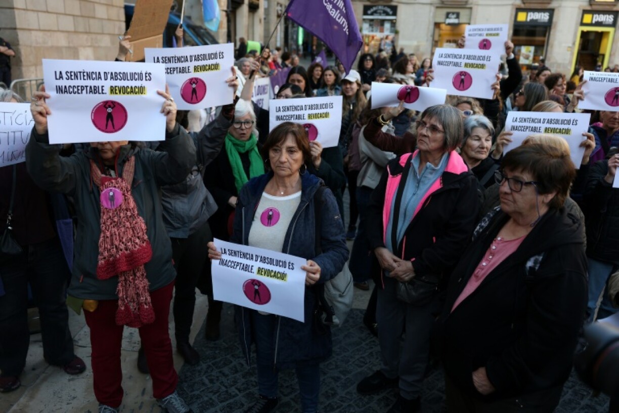 Hundreds of people rallied on Monday in Barcelona against a court ruling overturning Dani Alves' rape conviction