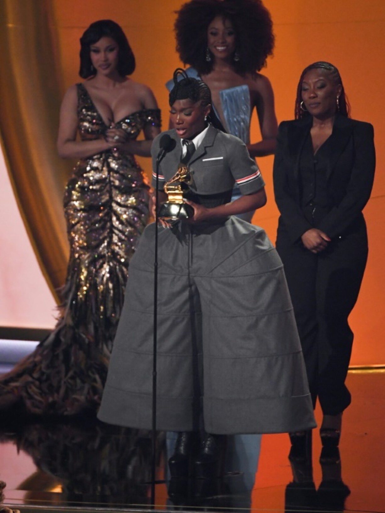 US rapper Doechii (C) tearfully accepted the Grammy for Best Rap Album