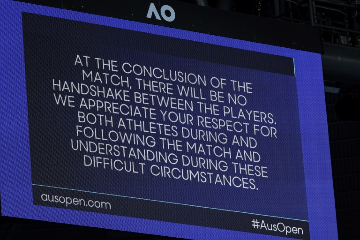 A notice on Rod Laver Arena explains there will be no handshake between Ukraine's Elina Svitolina and Russia' Veronika Kudermetova