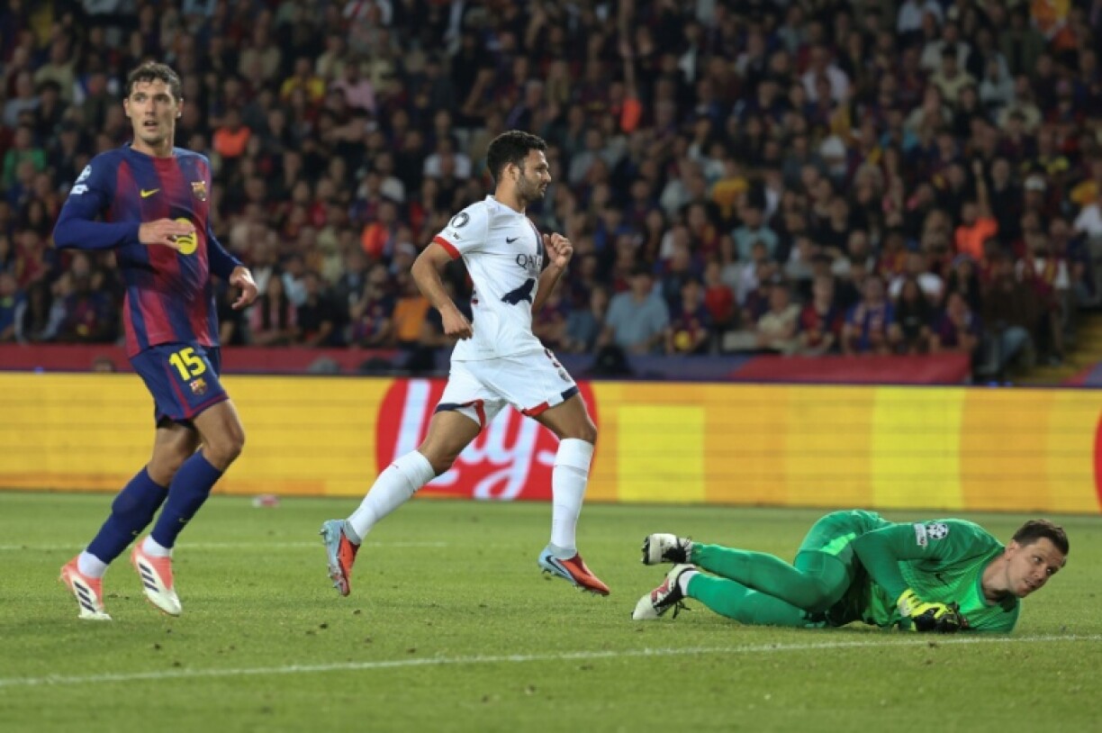 Paris Saint-Germain's Portuguese forward Goncalo Ramos scores their winner against Barcelona in an entertaining Champions League clash