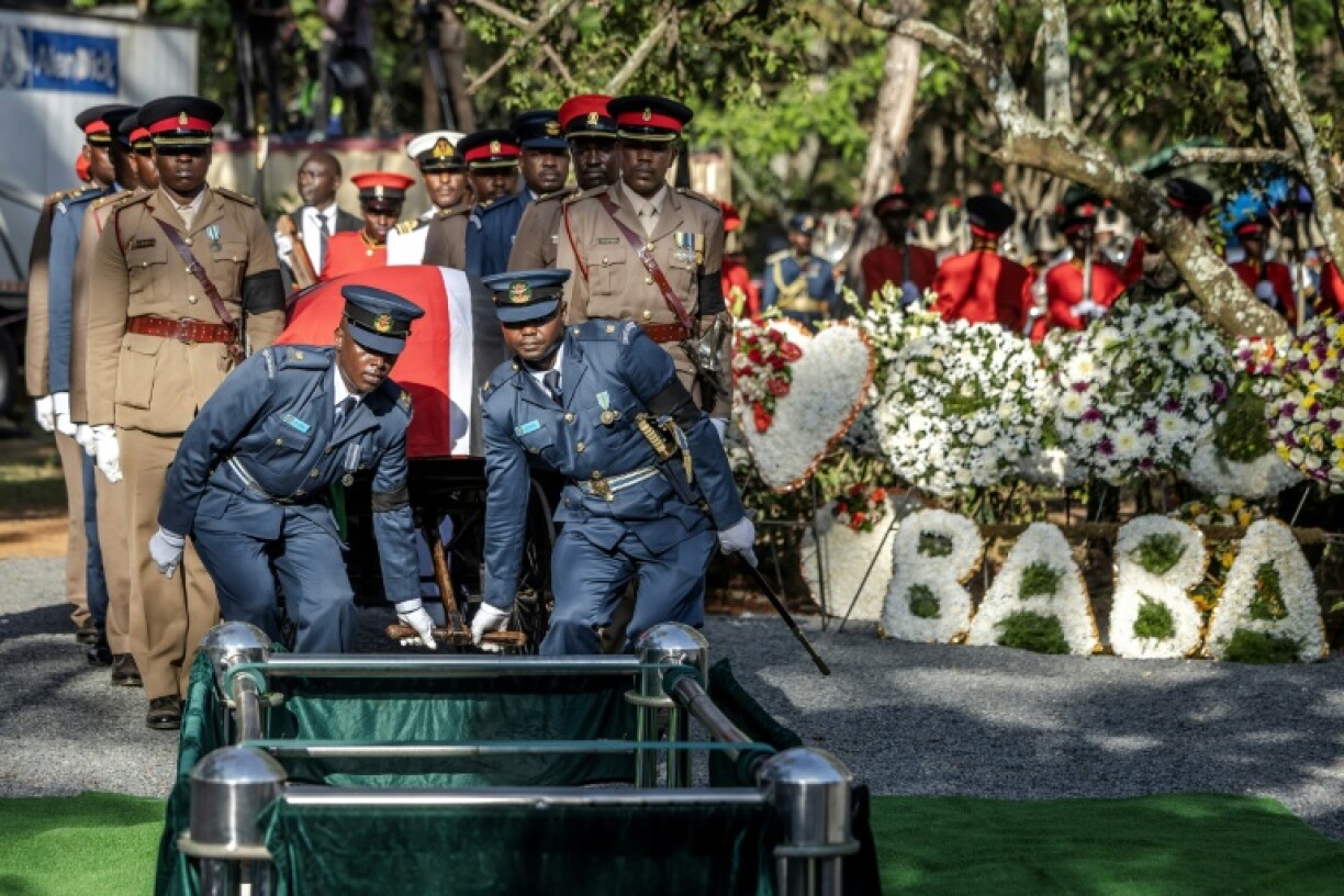 Military officers saluted as Odinga's coffin was lowered into the ground and trumpets played the Last Post