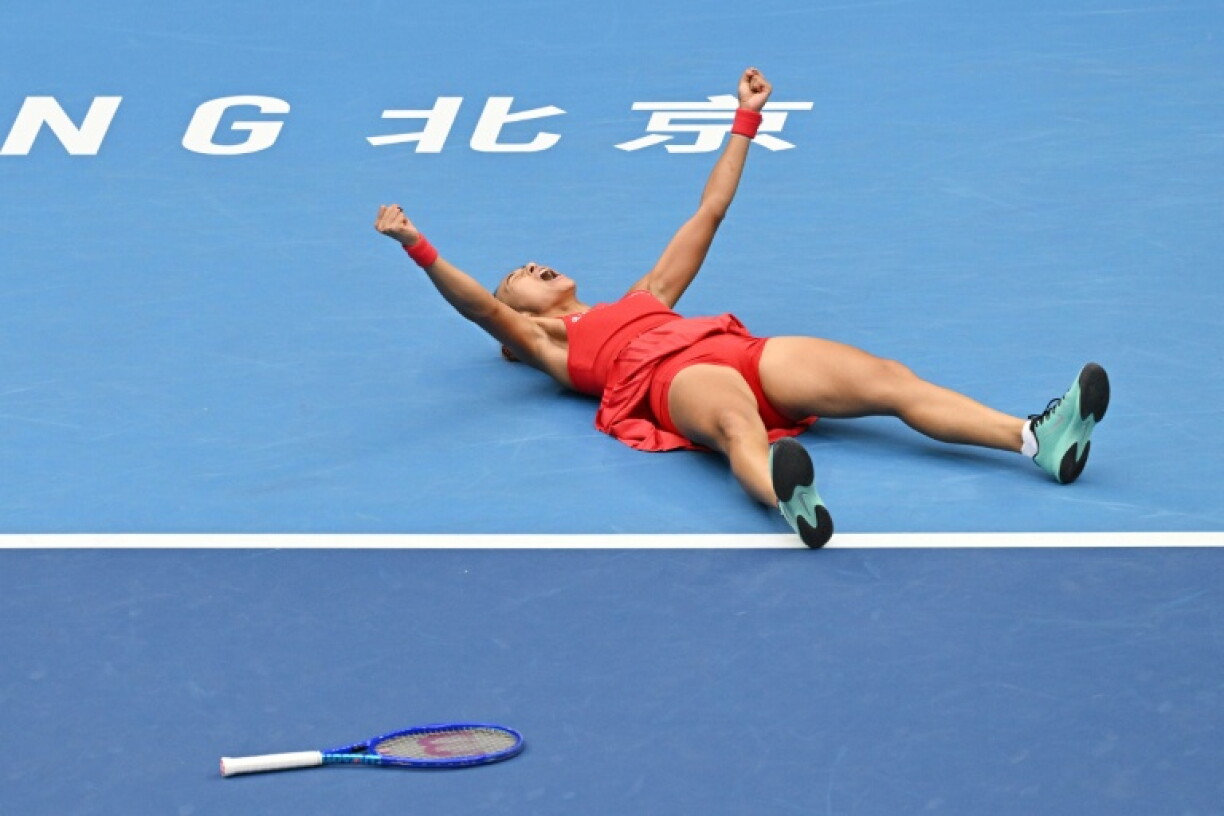 China's Zheng Qinwen celebrates after winning against Ukraine's Elina Svitolina in their women's singles quarter-final at the China Open tennis tournament in Beijing on October 9, 2026.
