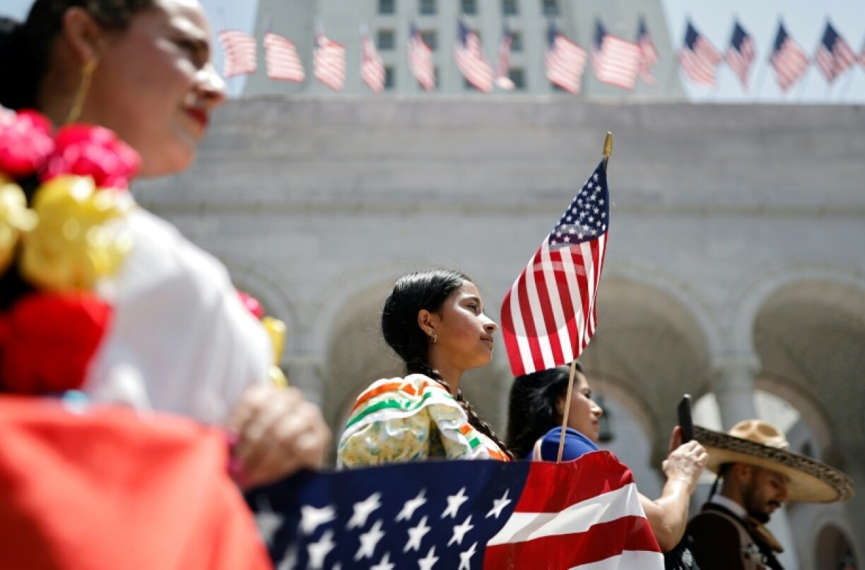 Mariachi and folklorico dancers protest outside Los Angeles City Hall, as protests against ICE immigration raids continue in the city