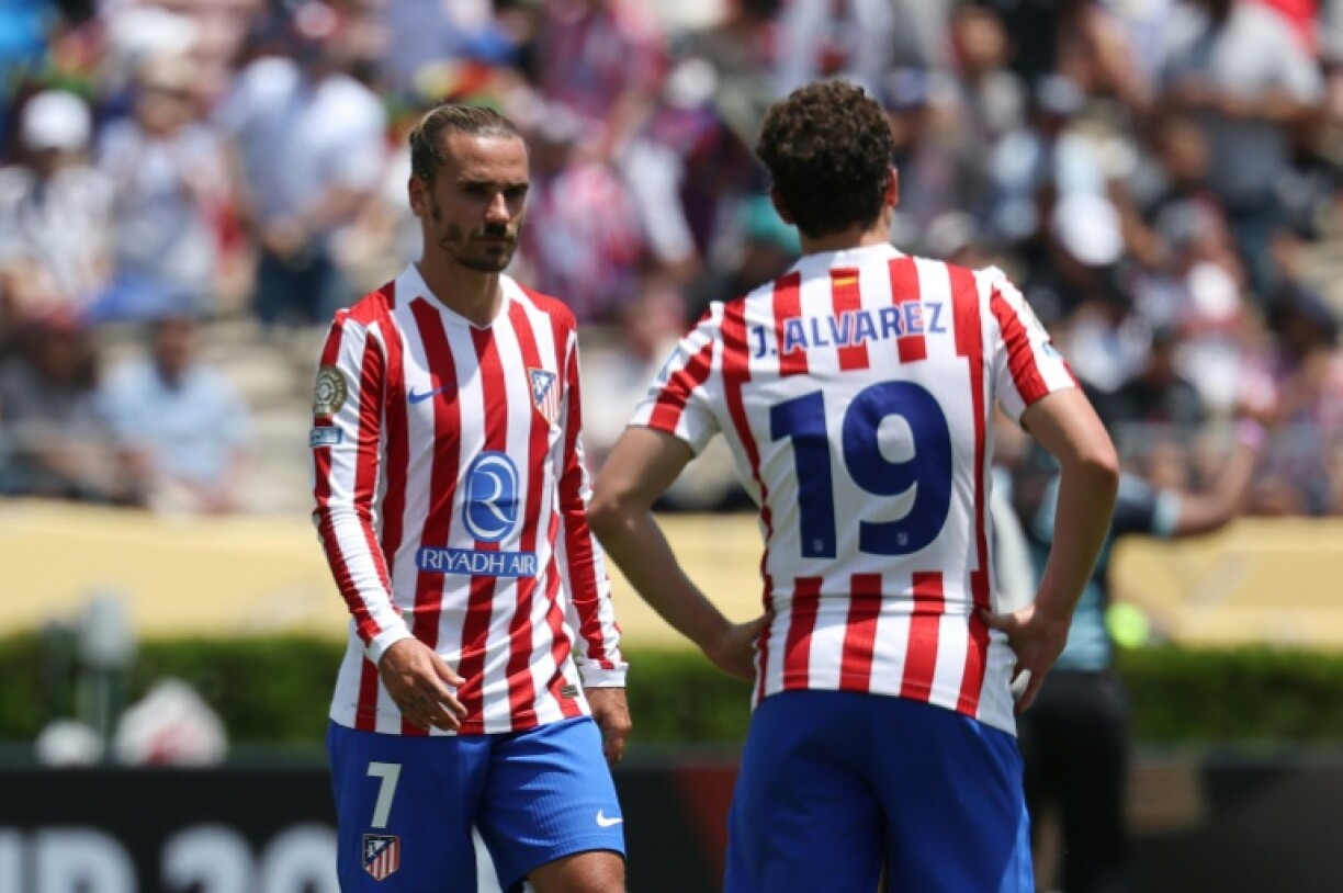 Atletico Madrid's Antoine Griezmann and his team-mate Julian Alvarez react after Club World Cup elimination on Monday