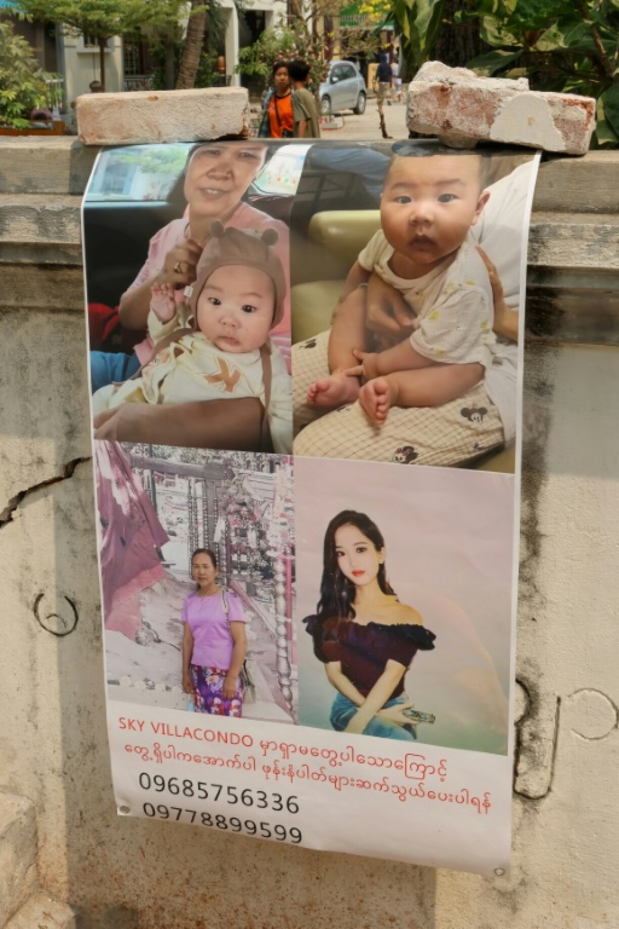 Missing posters printed on plastic sheets have begun to appear in the area around the disaster site