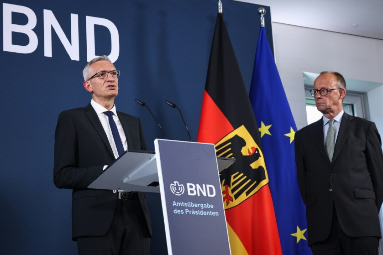 The current head of foreign intelligence service BND, Martin Jaeger, with Chancellor Friedrich Merz