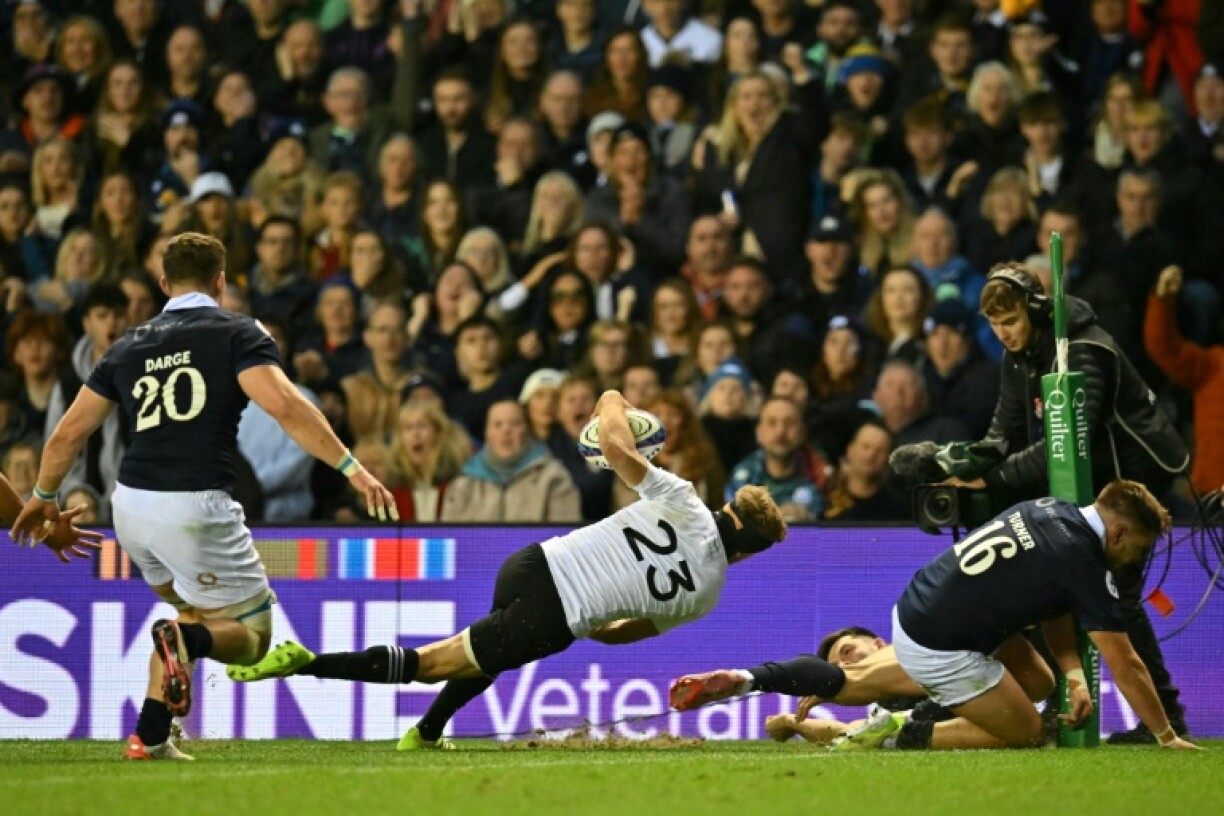 New Zealand's Damian McKenzie scores in the 25-17 win over Scotland at Murrayfield