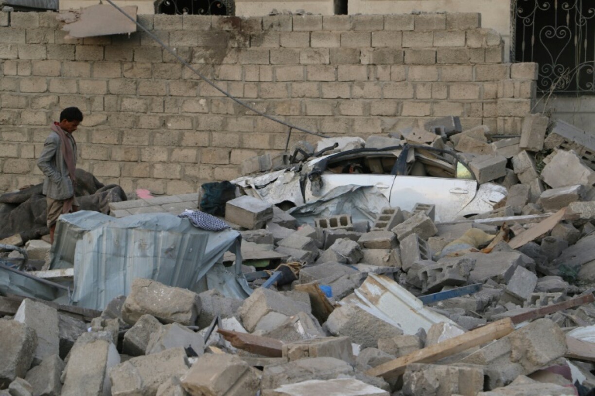 A man inspects the rubble of a house hit by a US strike on the weekend in Yemen's northern Saada province