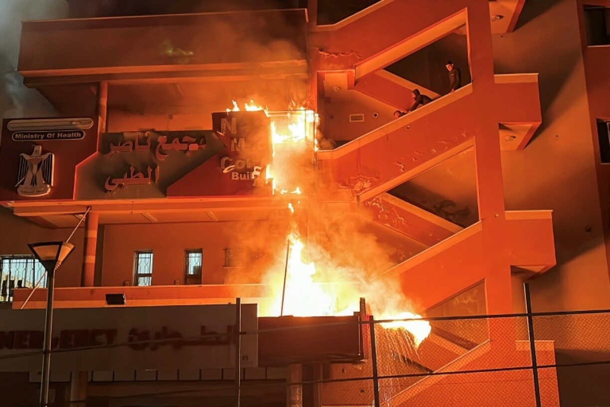 Fire burns at the emergency department of Nasser Hospital in Khan Yunis, southern Gaza, after an Israeli air strike