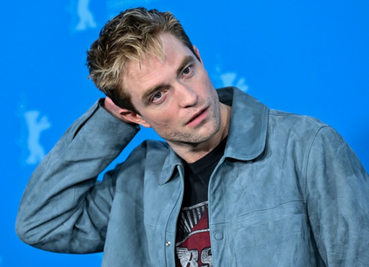 English actor Robert Pattinson poses during a photo call for the film