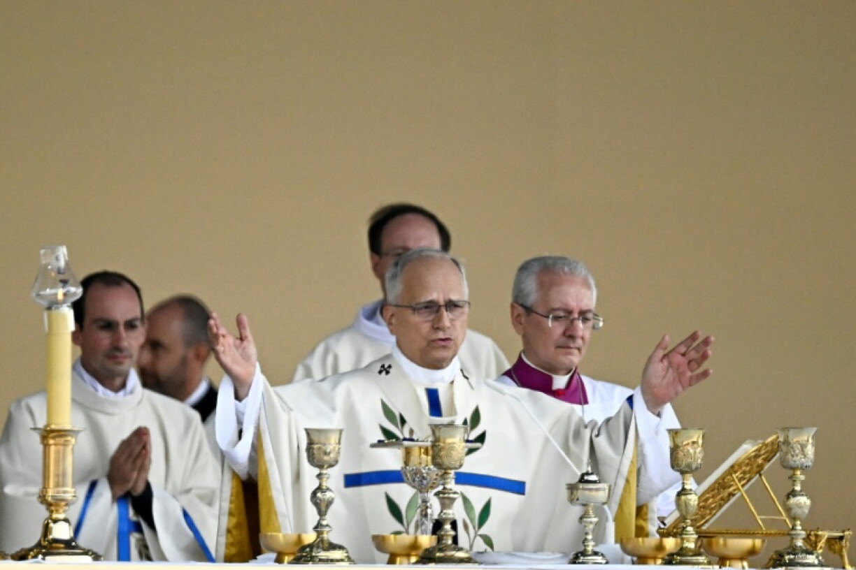 The pope's prayers were accompanied by choir and organ music as the sun broke through the grey skies