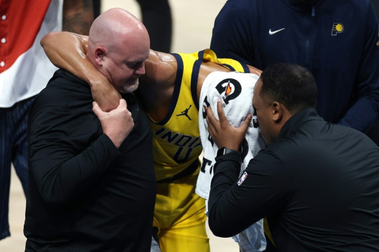 Tyrese Haliburton of the Indiana Pacers departs game seven of the NBA Finals after suffering a torn Achilles tendon
