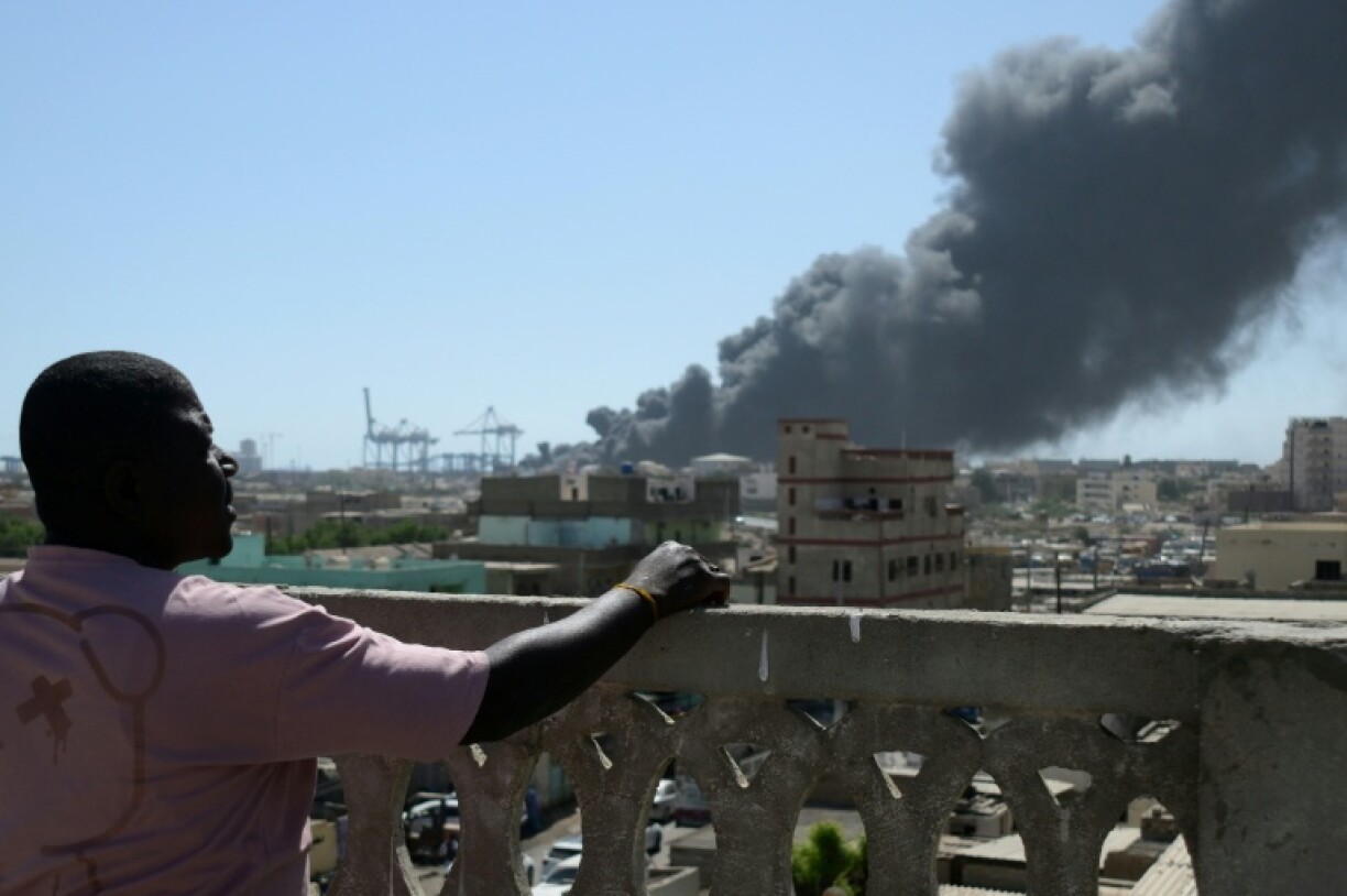 Smoke billows after a drone strike on the port of Port Sudan on May 6, 2025