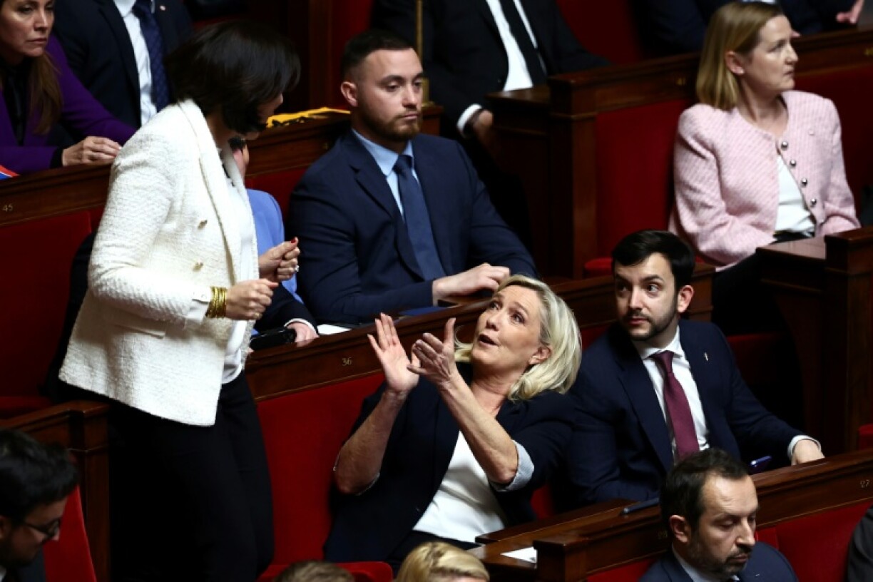Marine Le Pen, who remains an MP and head of her party's parliamentary faction, attended the session and was seen laughing and chatting with her colleagues
