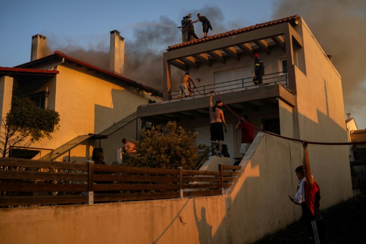 Several homes were ablaze as winds pushed fires through properties