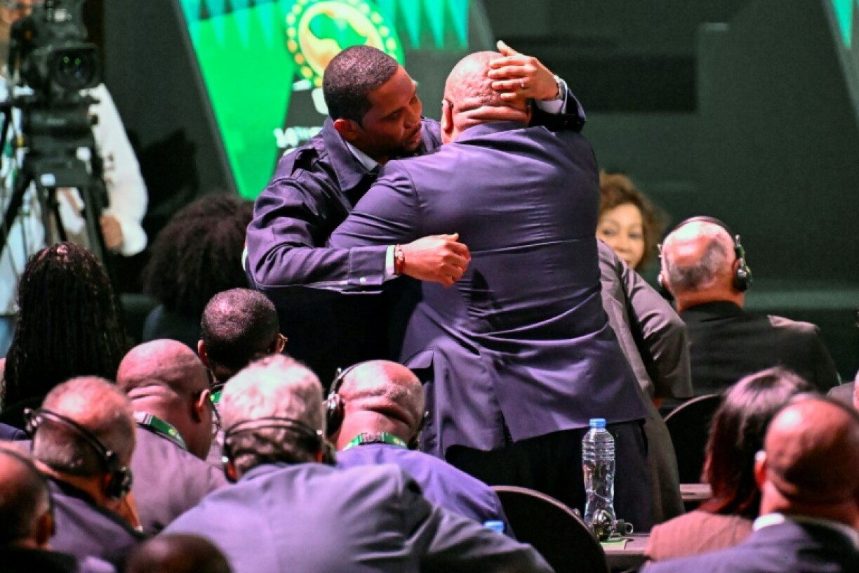 Samuel Eto'o (L) is congratulated in Cairo on Wednesday after being elected to the Confederation of African Football (CAF) executive committee.