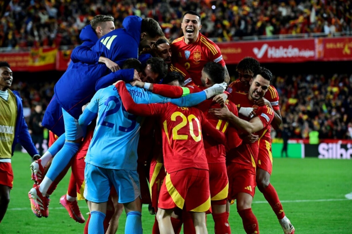 Spain's players celebrate after the UEFA Nations League quarter-final win over Netherlands in Valencia