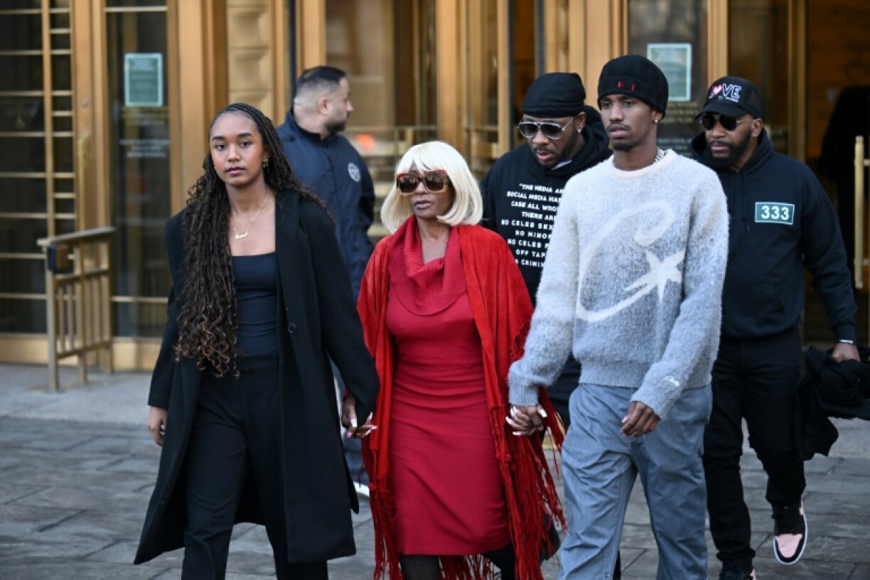 Sean 'Diddy' Combs's children Chance Combs (L) and Christian Combs (R) and his mother Janice Combs depart a pre-trial hearing in Manhattan on March 14