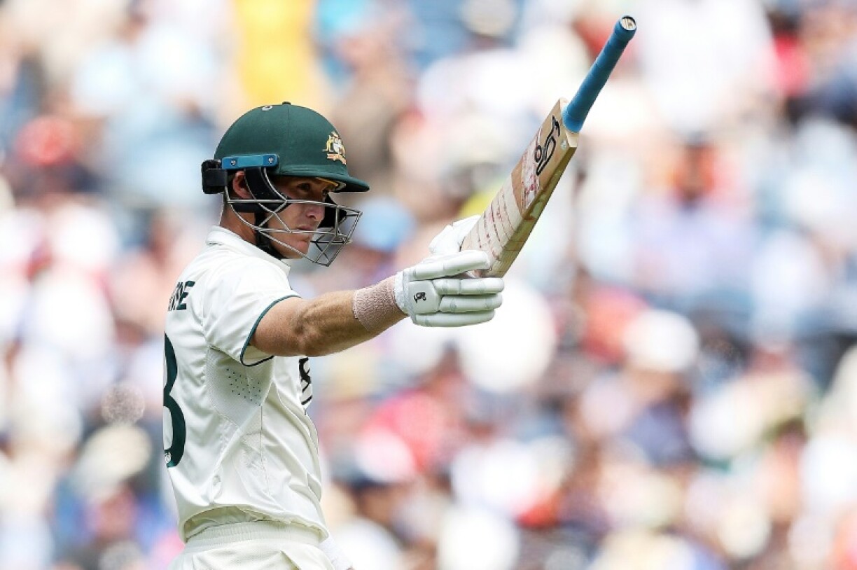 Australia's Marnus Labuschagne raises his bat after passing 50 on day four of the fourth Test against India