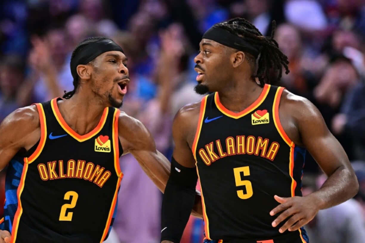 Shai Gilgeous-Alexander, left, and Luguentz Dort, right, of Oklahoma City celebrate during the second half of the Thunder's 105-92 victory over Boston