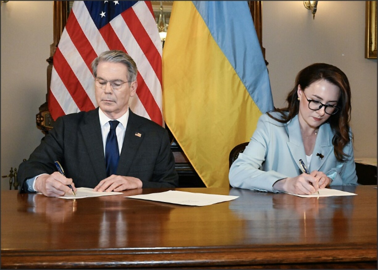 US Treasury Secretary Scott Bessent and Ukrainian First Deputy Prime Minister Yulia Svyrydenko sign a minerals deal at the Treasury Department