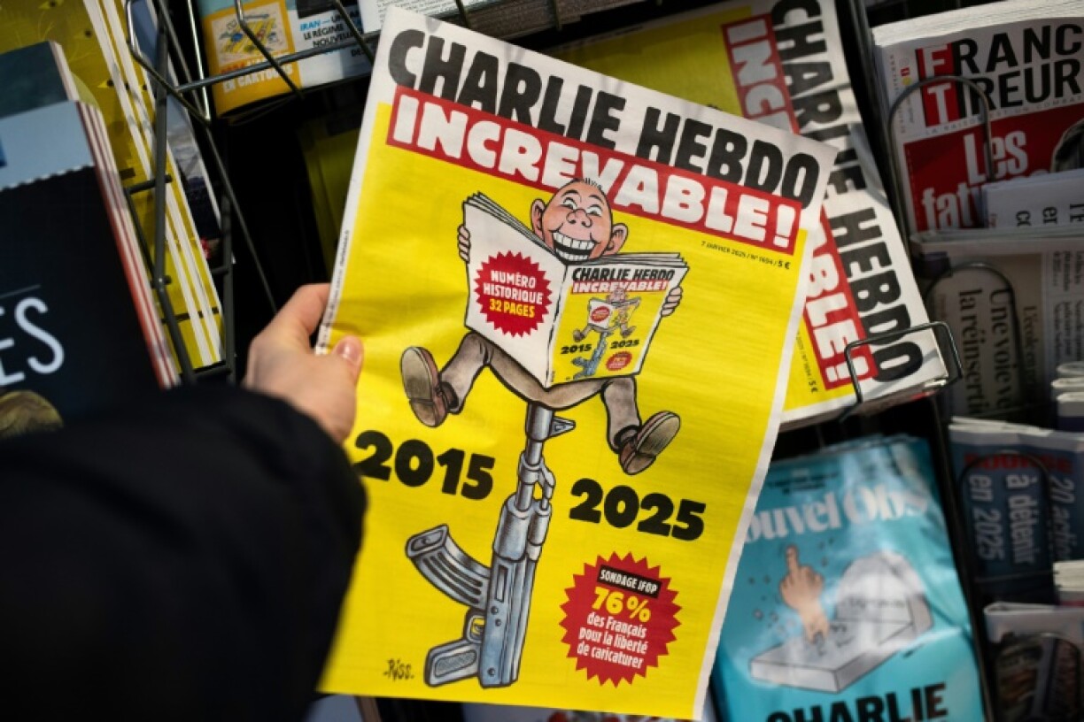 The front page of Charlie Hebdo featuring a reader sitting on an AK-47 with the caption 'Indestructible'