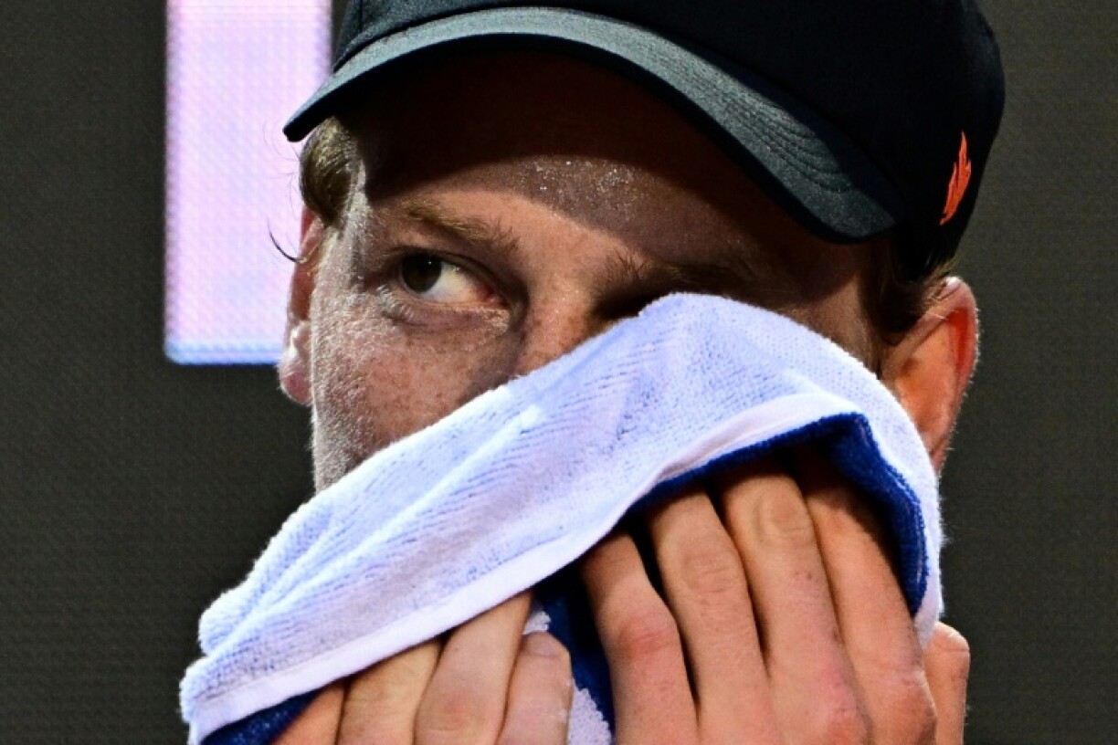 Jannik Sinner washes his face during an open training ahead of his return to action at the Rome Open