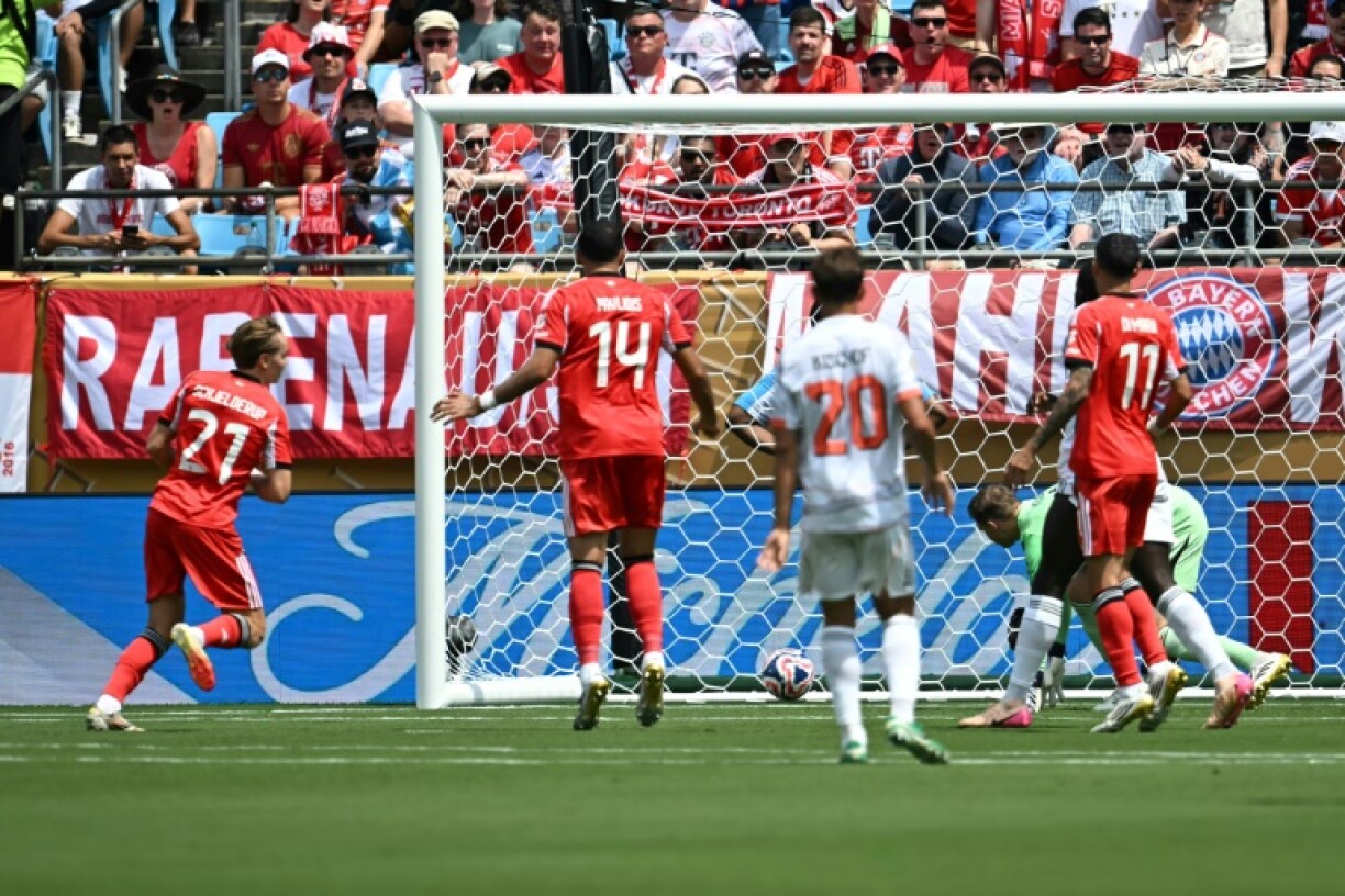 Andreas Schjelderup (L) scores Benfica's winning goal against Bayern Munich in Charlotte