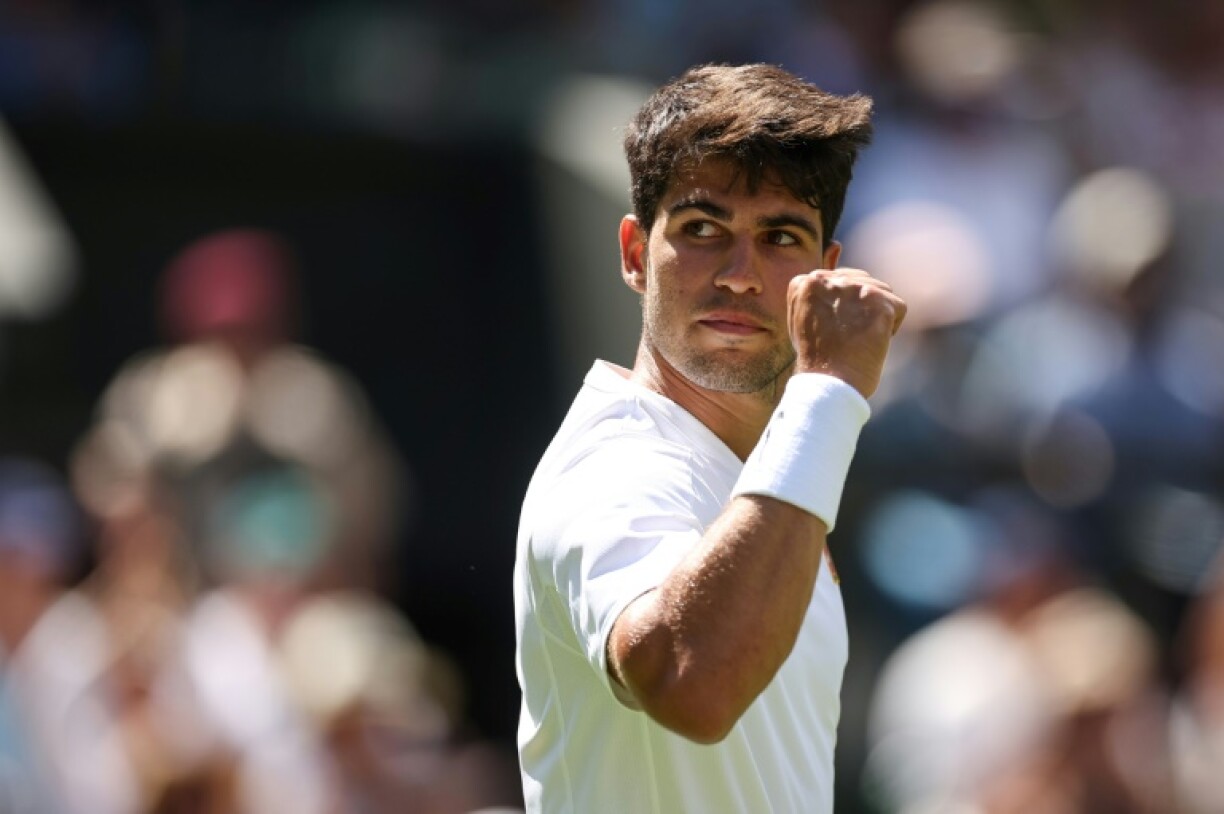 Carlos Alcaraz celebrates during his Wimbledon first round win over Fabio Fognini