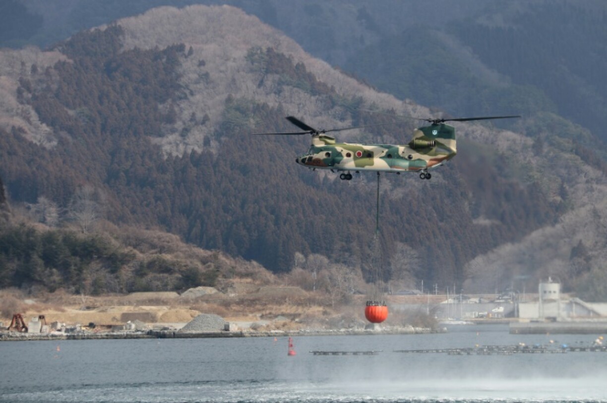 Military and fire department helicopters have been trying to douse the wildfire