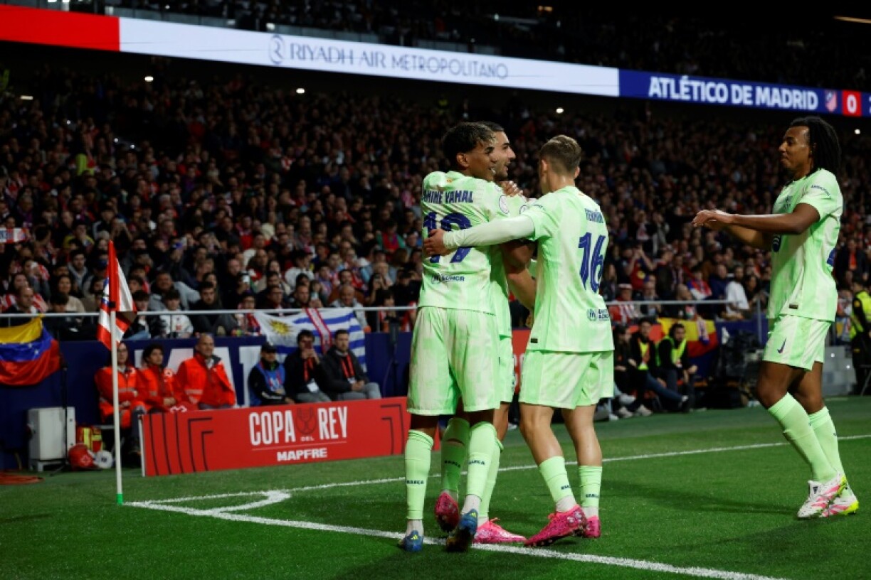 Barcelona's Spanish forward Ferran Torres (2L) celebrates scoring against Atletico Madrid in the Copa del Rey semi