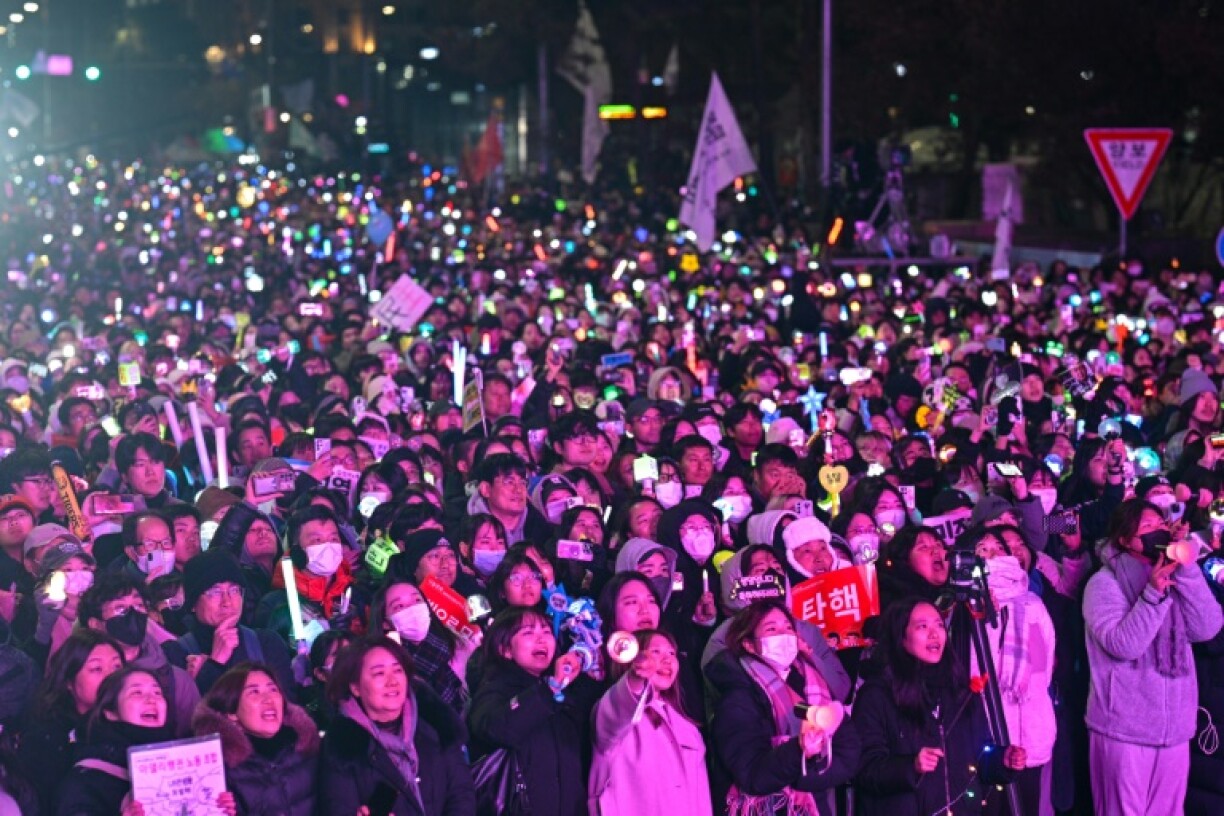 Protesters calling for the ouster of President Yoon Suk Yeol react after the result of the impeachment vote outside the National Assembly in Seoul