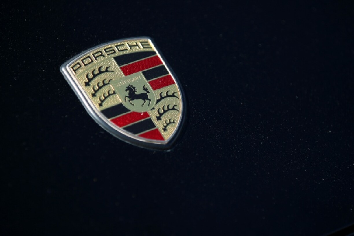 Porsche has said it will delay the introduction of some fully electric cars and extend the life of some combustion engine and hybrid models